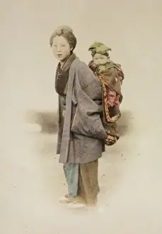 Mother carrying child on her back