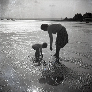 Mother and child on St Ives beach at sunset Mother and child on St Ives beach at sunset