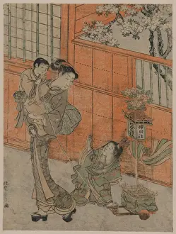 Mother and children pulling a toy float of the Kanda parade