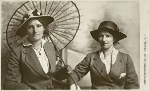 A Mother and daughter have a duo portrait photograph taken at the American Studio