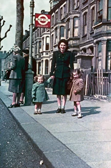 Shabby Gallery: Mother and daughters at a London bus stop