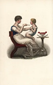 Feed Gallery: Mother feeding her child on her lap