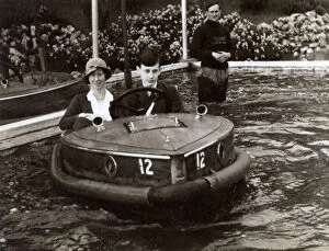 Pilots Collection: Mother and son riding a Rytecraft Scoota-boat - Llandudno