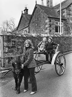 Mother taking children to school in pony and trap, Cornwall
