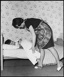 Mother Tucking Son In