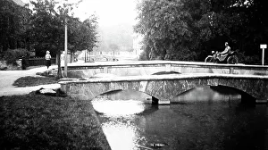 Motorcyclist on a bridge in Bourton on the Water