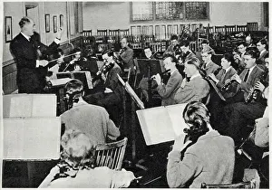 Conducting Prints: Mr Allen conducting the school orchestra in the Music School at Wellington College