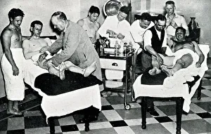 Tottenham Prints: Mr Hardy, Tottenham Hotspur trainer, massage demonstration