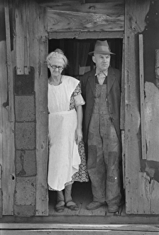Mr. and Mrs. John Landers, tenant farmers, at the backdoor o Mr. and Mrs. John Landers, tenant farmers, at the backdoor o