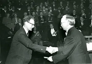 Mr Smith, left, is presented with the British Gold Medal?