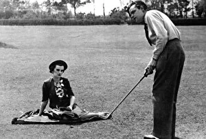 Personality Gallery: Mrs Charles Sweeny watching her husband play golf