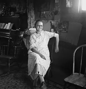 Oregon Prints: Mrs. Hull, in one room basement dugout home, late afternoon