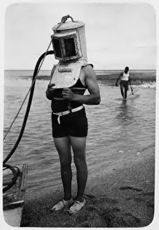 Archive Prints: Mrs Stephenson wearing a diving helmet