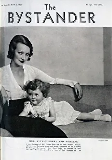 Mrs Vyvyan Drury (1907-1996) and daughter, Romayne, studio portrait seated on couch. With description, A new photograph of Mrs Vyvyan Drury and her small daughter, Romayne, who is a most fascinating person