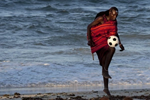 Images Dated 1st March 2011: Msai Tribesman - rests playing football after