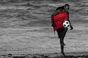 Images Dated 1st March 2011: Msai Tribesman - rests playing football after