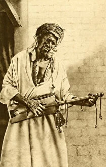 Images Dated 25th July 2018: Musician with guitar, Algeria, North Africa
