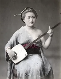Musician playing shamisen, Japan, c. 1880