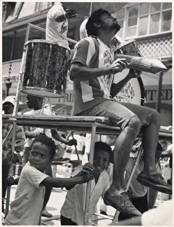 Afro Prints: A musician sits on a float in an ecstatic trance
