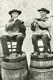 Brim Gallery: Musicians seated on barrels, Brittany, Northern France