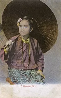 Images Dated 11th August 2015: Myanmar - A Burmese girl with large open paper parasol