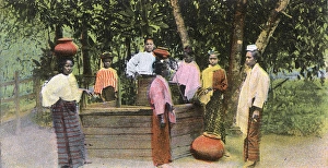 Images Dated 11th August 2015: Myanmar - Village Scene - Women drawing water from the well