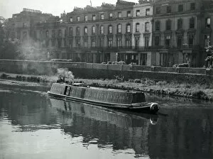 A narrow boat on the Regents Canal, London, Enland. Date: 1950s