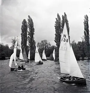 National 12 sailing dinghies on a Devon river