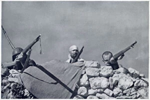 Images Dated 9th June 2021: Some Nationalist irregular troops firing at a Republican position near Huesca