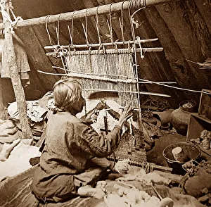 Navajo Prints: Navajo Indian making a rug on a loom