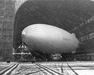 Snowstorm Prints: US Navy Goodyear K-Series entering a hangar