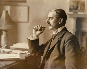 Neville Chamberlain, British politician, at his desk