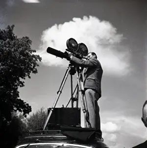 Adams Prints: Newsreel cameraman in action