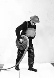 Method Prints: NFS firefighter rolling out fire hose, WW2