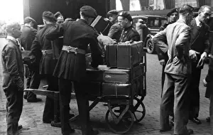 NFS personnel loading luggage, St Pancras, WW2