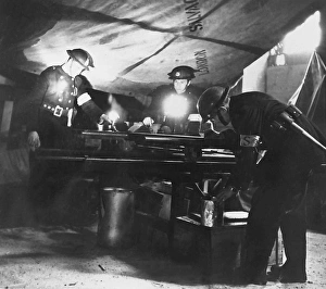 Images Dated 28th November 2011: NFS (Salvage Corps) workers at a fire, WW2