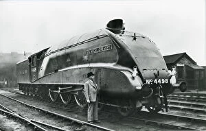 Images Dated 30th September 2021: Nigel Gresley standing alongside his A4 class steam engine