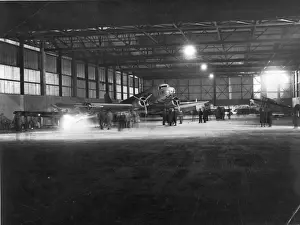 Night-time hangar scene with a Douglas DC-3 of KLM
