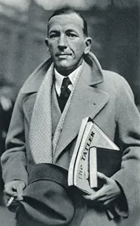 Coward Prints: Noel Coward carrying The Tatler