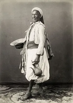 North African man with jug and dish