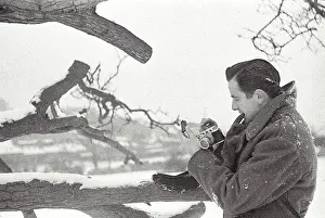 Photos Prints: North Yorkshire winter outside in snow in uniform concentrating on camera Date: 1947 - 1948