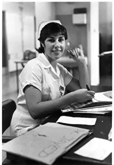 Tilley Prints: Nurse seated at desk