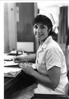 Nurse seated at desk