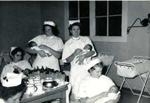Images Dated 5th April 2017: Nurses with babies in hospital nursery