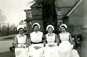 Chapman Collection: Nurses on bench outside hospital