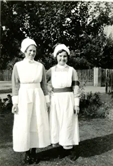 Two nurses in a garden