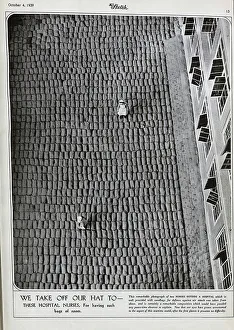 Sandbags Prints: Two nurses in uniform, on thousands of sandbags