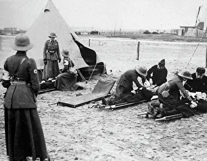 Applying Prints: Nurses Yeomanry Corps apply first aid behind the front line
