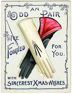 Odd pair of gloves with comic greeting on a Christmas card
