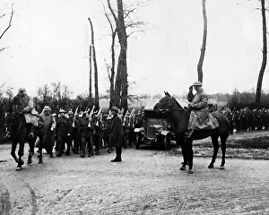 Officer on horseback saluting troops, Western Front, WW1